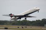 N901DE @ KSRQ - Delta MD-88  departs Runway 14 at Sarasota Bradenton International Airport - by Suncoast Spotter