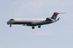 N708PS @ KSRQ - PSA Airlines/US Airways Express CRJ-700 on approach to Runway 32 at Sarasota-Bradenton International Airport - by Suncoast Spotter