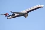 N708PS @ KSRQ - PSA Airlines/US Airways Express CRJ-700 departs from Runway 14 at Sarasota Bradenton International Airport - by Suncoast Spotter