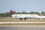 N902DE @ KSRQ - Delta MD-88 arrives on Runway 14 at Sarasota-Bradenton International Airport - by Suncoast Spotter
