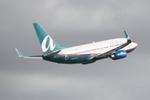 N273AT @ KSRQ - AirTran Boeing 737-700 departs from Runway 14 at Sarasota-Bradenton International Airport - by Suncoast Spotter