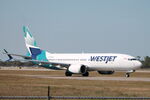 C-GFJM @ KRSW - WestJet Flight 1263 taxis at Southwest Florida International Airport prior to flight to Ottawa International Airport - by Suncoast Spotter