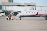 N719PS @ KSRQ - PSA Airlines/US Airways Express CRJ-700 pushes back from the gate at Sarasota-Bradenton International Airport - by Suncoast Spotter