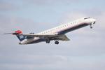 N719PS @ KSRQ - PSA Airlines/US Airways Express CRJ-700 departs from Runway 14 at Sarasota-Bradenton International Airport enroute to Charlotte/Douglas International Airport - by Suncoast Spotter