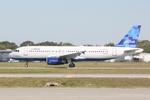 N760JB @ KSRQ - Jet Blue Airbus A320 The Blues Were Made For Flying departs Runway 32 at Sarasota-Bradenton International Airport - by Suncoast Spotter