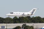 N439LX @ KSRQ - Beechcraft Beechjet arrives on Runway 32 at Sarasota-Bradenton International Airport - by Suncoast Spotter