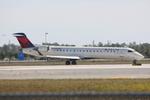 N614QX @ KRSW - Atlantic Southeast/Delta Connections Flight 5495  taxis for departure at Southwest Florida International Airport prior to a flight to Memphis International Airport