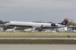N907FJ @ KSRQ - Mesa/US Airways Flight 2607 arrives on Runway 32 at Sarasota-Bradenton International Airport following a flight from Charlotte-Douglas International Airport - by Suncoast Spotter