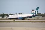 N281AT @ KSRQ - AirTran Flight 696 arrives on Runway 14 at Sarasota-Bradenton International Airport following a flight from Hartsfield-Jackson Atlanta International Airport - by Suncoast Spotter