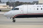 N924FJ @ KSRQ - Mesa/US Flight 2607 arrives on Runway 14 at Sarasota-Bradenton International Airport following a flight from Charlotte/Douglas International Airport