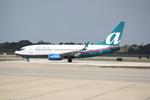 N278AT @ KSRQ - AirTran Flight 696 arrives on Runway 14 at Sarasota-Bradenton International Airport following a flight from Hartsfield-Jackson Atlanta International Airport - by Suncoast Spotter