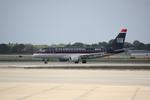 N811MD @ KSRQ - Republic/US Air Flight 3399 arrives on Runway 14 at Sarasota-Bradenton International Airport following a flight from Reagan National Airport