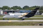 N116JG @ KSRQ - N116JG arrives on Runway 14 at Sarasota-Bradenton International Airport - by Suncoast Spotter