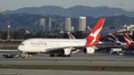 VH-OQK @ KLAX - Getting towed to parking at LAX - by ToddRoyer