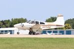 N234M @ KOSH - Beech D95A - by Mark Pasqualino