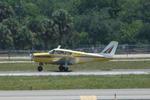 N7891P @ KSRQ - Piper Comanche departs Runway 32 at Sarasota-Bradenton International Airport - by Suncoast Spotter