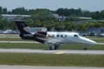 N255EE @ KSRQ - Embraer Phenom - N255EE taxis for departure at Sarasota-Bradenton International Airport - by Suncoast Spotter
