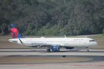 N394DX @ KTPA - Delta Flight 2852 arrives on Runway 1L at Tampa International Airport following flight from Detroit Metro Airport - by Suncoast Spotter