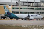 C-GFJO @ KRSW - WestJet Flight 4138 sits at Gate C1 at Southwest Florida International Airport prior to flight to Toronto-Pearson International Airport