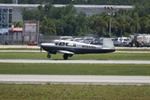 N1048D @ KSRQ - Mooney M-20 departs Runway 32 at Sarasota-Bradenton International Airport - by Suncoast Spotter