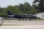 N64JP @ KSRQ - Learjet 60 sitting on the ramp at APP Jet Center