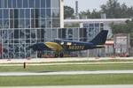 N633TC @ KSRQ - Piper Seneca performs a touch and go at Sarasota-Bradenton International Airport - by Suncoast Spotter