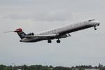 N919FJ @ KSRQ - US Air Flight 2607 operated by Mesa departs Sarasota-Bradenton International Airport enroute to Charlotte Douglas International Airport