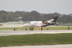 N353SB @ KSRQ - Embraer Phenom 100 departs Sarasota-Bradenton International Airport enroute to Lakeland Linder Airport - by Suncoast Spotter