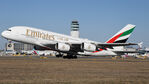 A6-EEF @ LOWW - Lifting off from runway 29 with the ATC tower in the backdrop - by Hotshot