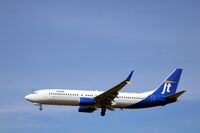 OY-JYB @ EKCH - OY-JYB landing rw 22L - by Erik Oxtorp