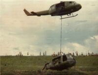 72-21646 @ A511 - 646 slinging crashed UH-1H out of rice paddy, summer 1976 near Teague Korea - by Sp5 Robert Augur
