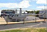 G-CGNE @ EGTB - Robinson R44 Raven II at Wycombe Air Park. - by moxy