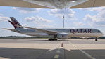 A7-ALB @ LOWW - Taxiing by parked UAE A380 and seen from underneath the big bird. - by Hotshot