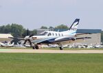 N427C @ KOSH - Socata TBM-700 - by Mark Pasqualino