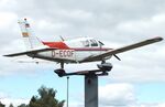 D-ECOF - Piper PA-28-140 Cherokee Cruiser, mounted as a giant weather vane outside the Siegerland Airport, Burbach - by Ingo Warnecke
