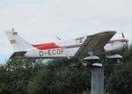 D-ECOF - Piper PA-28-140 Cherokee Cruiser, mounted as a giant weather vane outside the Siegerland Airport, Burbach - by Ingo Warnecke