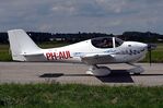 PH-AUL @ LOLW - With a friendly cö-pilot at Rotax Days, Wels, Austria - by Reinhard Jost