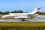 N481QS @ KAPF - Netjets EMB550 taxying to the runway - by FerryPNL