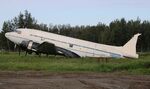 N305SF @ PAAQ - DC-3C N305SF without vertical rudder in need of maintenance in a meadow close to Palmer Municipal, AK - by Reinhard Jost