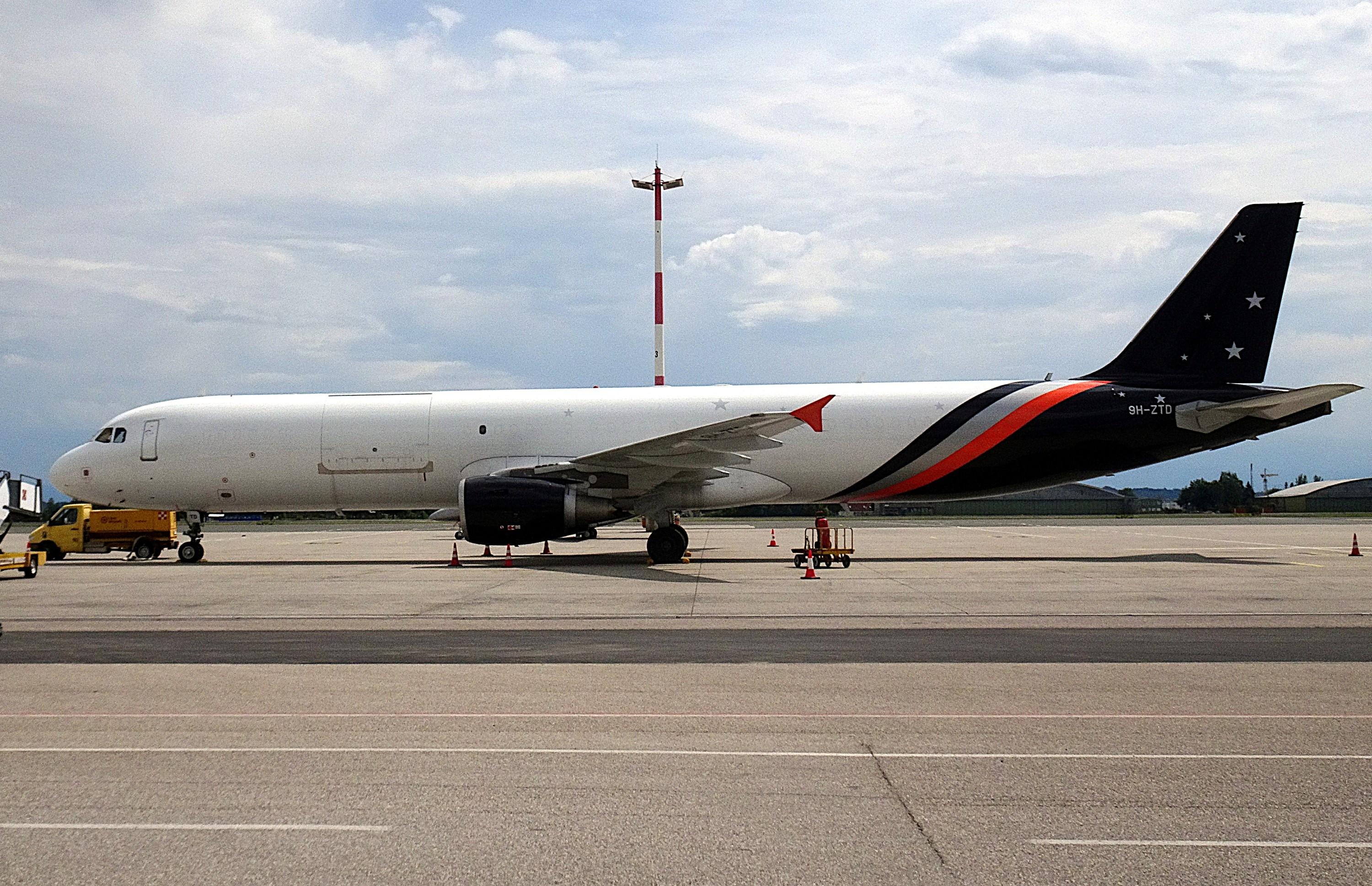 9H-ZTD @ LOWL - After conversion to A320-211P2F  with a big cargo door in Titan colors but without titles during a freigth service at Linz, Austria - by ReinhardJost
