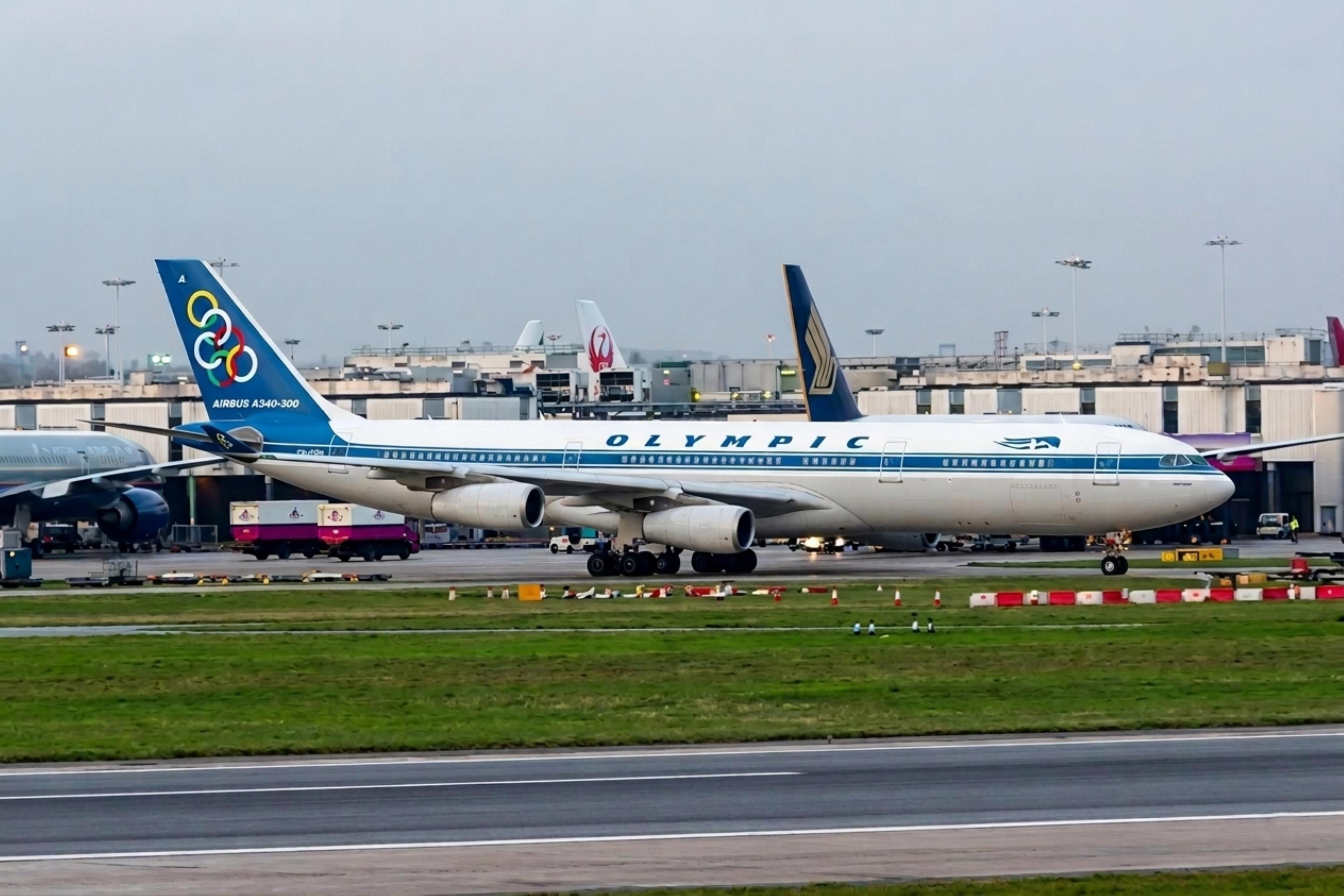 SX-DGA @ EGLL - SX-DFA 1999 A340-313 Olympic Airlines LHR - by PhilR
