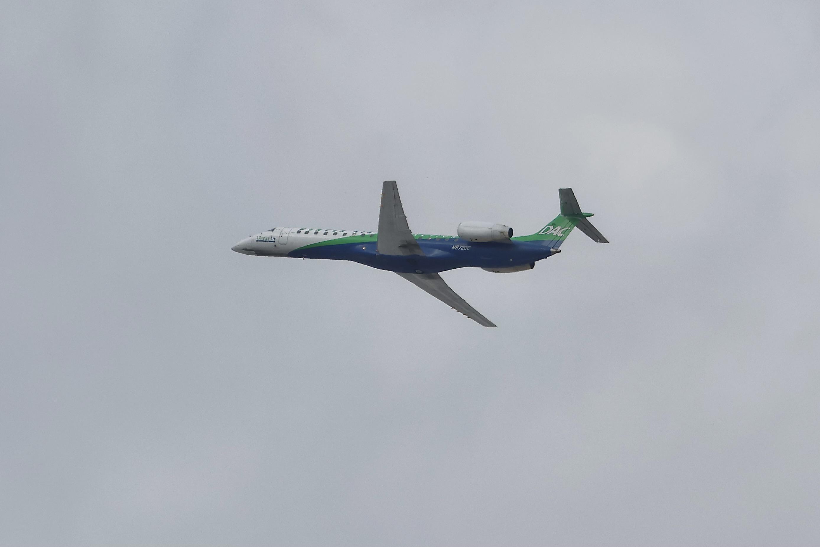 N972DC @ KORD - E145 KEY LIME AIR ERJ-145LR N972DC departing28R KORD - by MarkKalfas