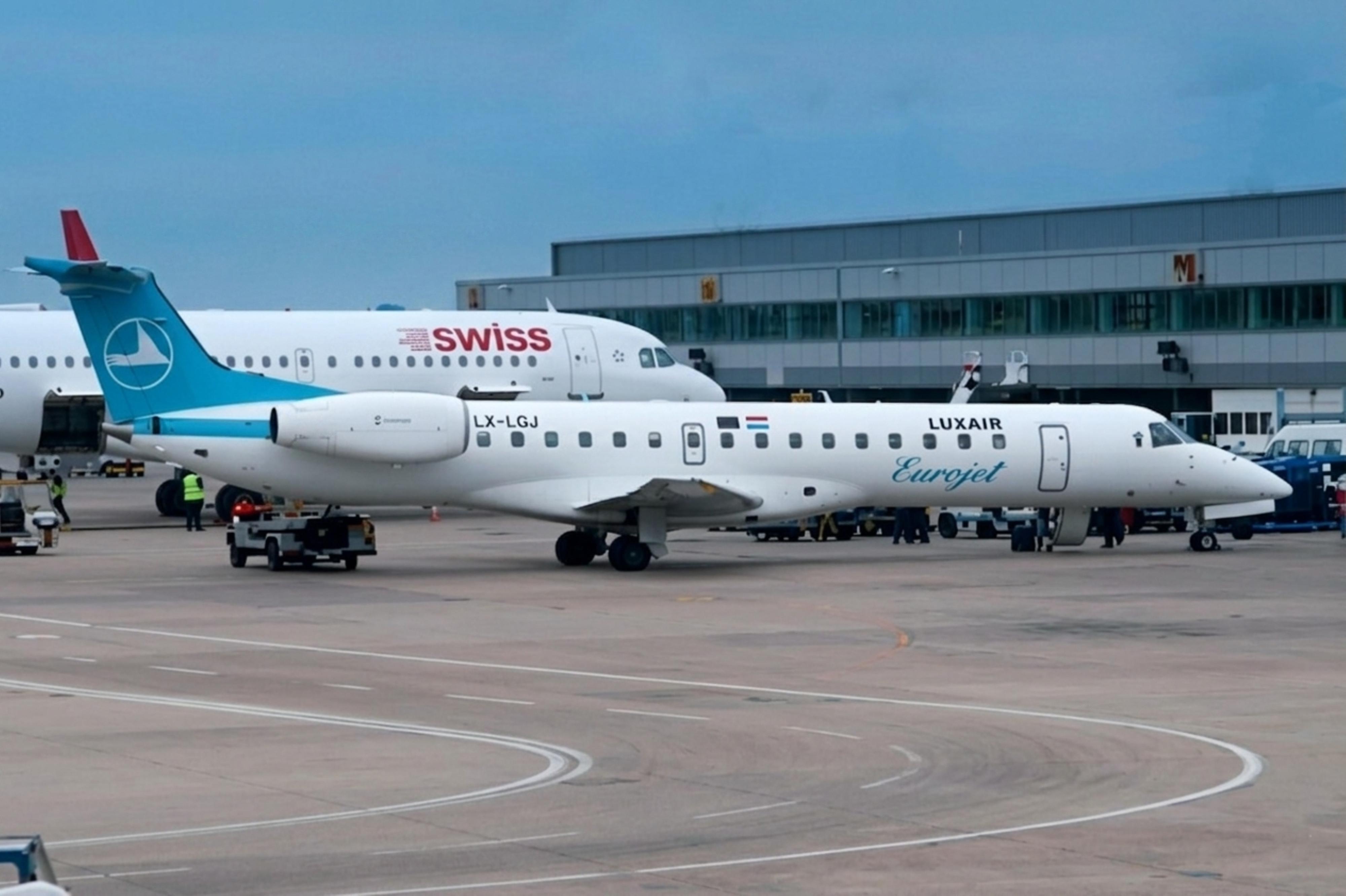 LX-LGJ @ EGCC - LX-LGJ Embraer RJ145 Luxair MAN  - by PhilR
