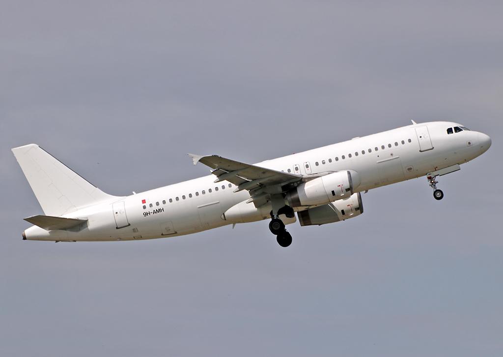 9H-AMH @ LFBO - Climbing after take off from rwy 32R... All white c/s without titles... Operated by Tunisair this day... - by Shunn311