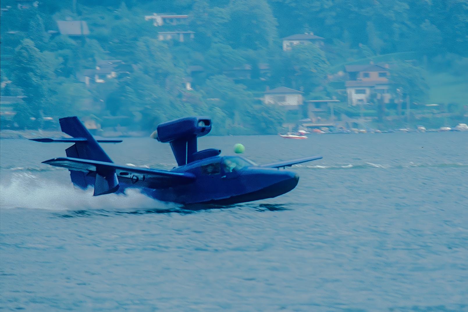 N1401G @ LSZA - Taking-off from Lake Lugano. SPAS-Meeting Morcote. Scanned from a slide. - by sparrow9