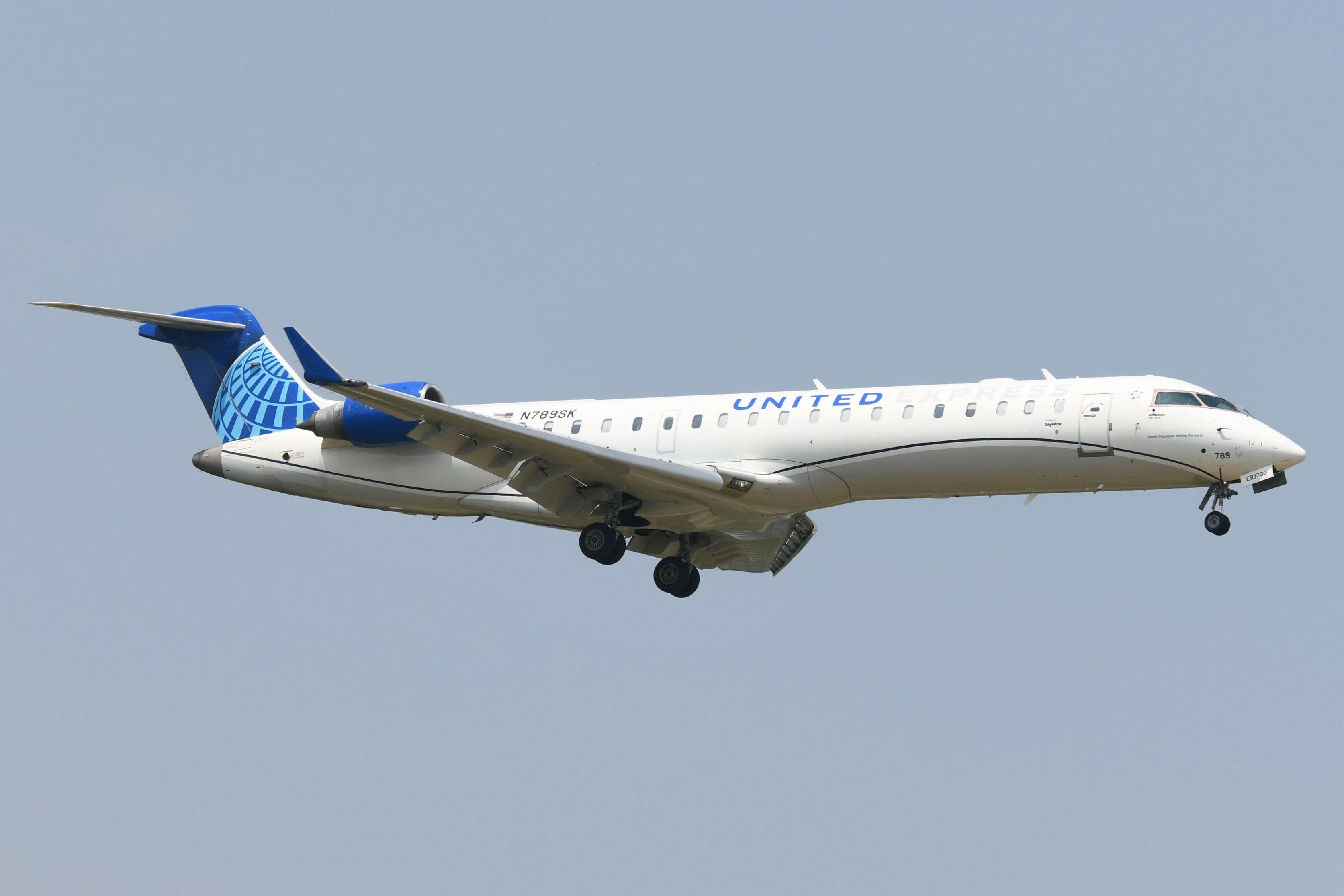 Aircraft N789SK, United Express CL700 arriving, at KMKE, photo by FerryPNL