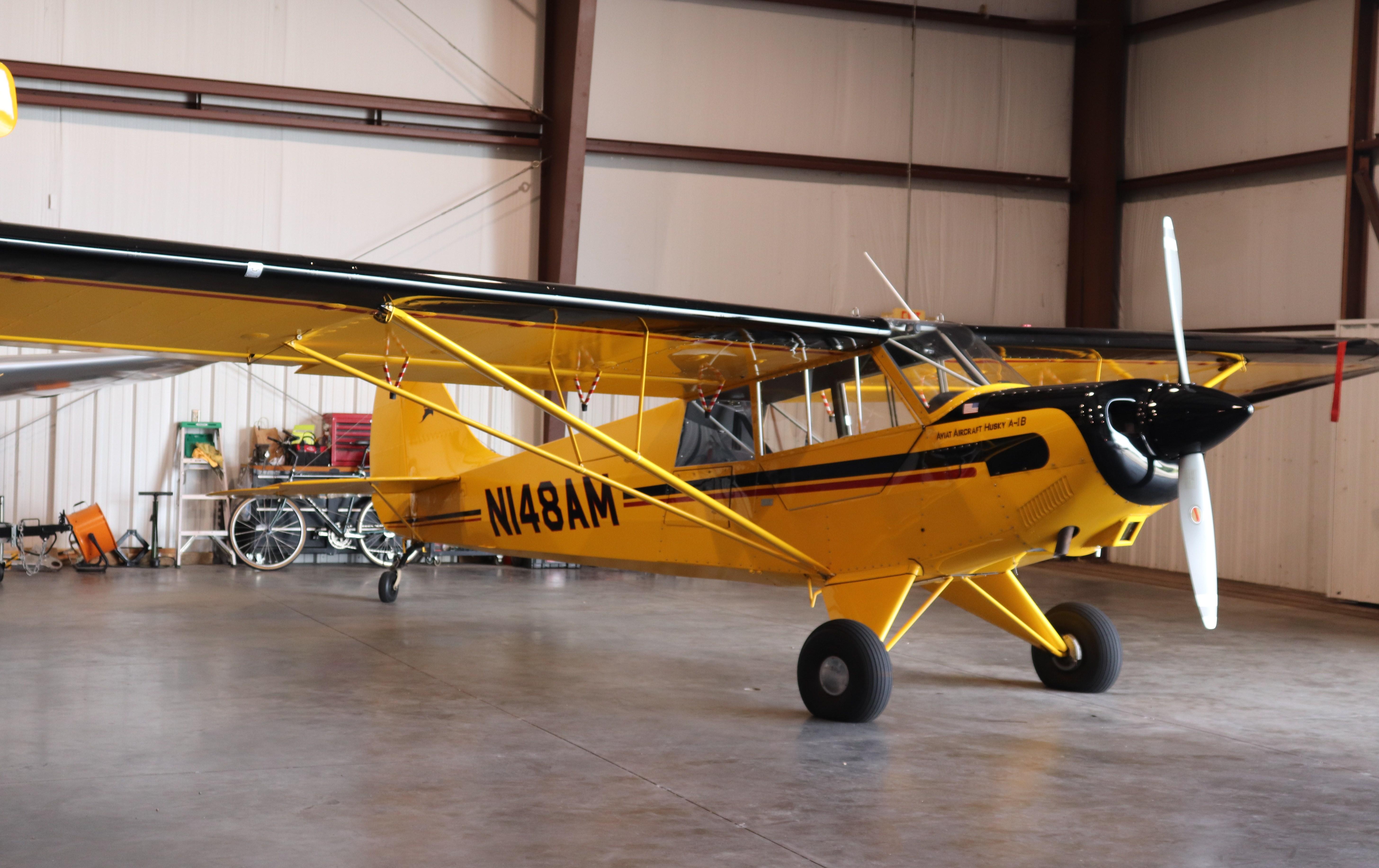 Aircraft N148AM, Aviat A-1B, at KISM, photo by MarkPasqualino