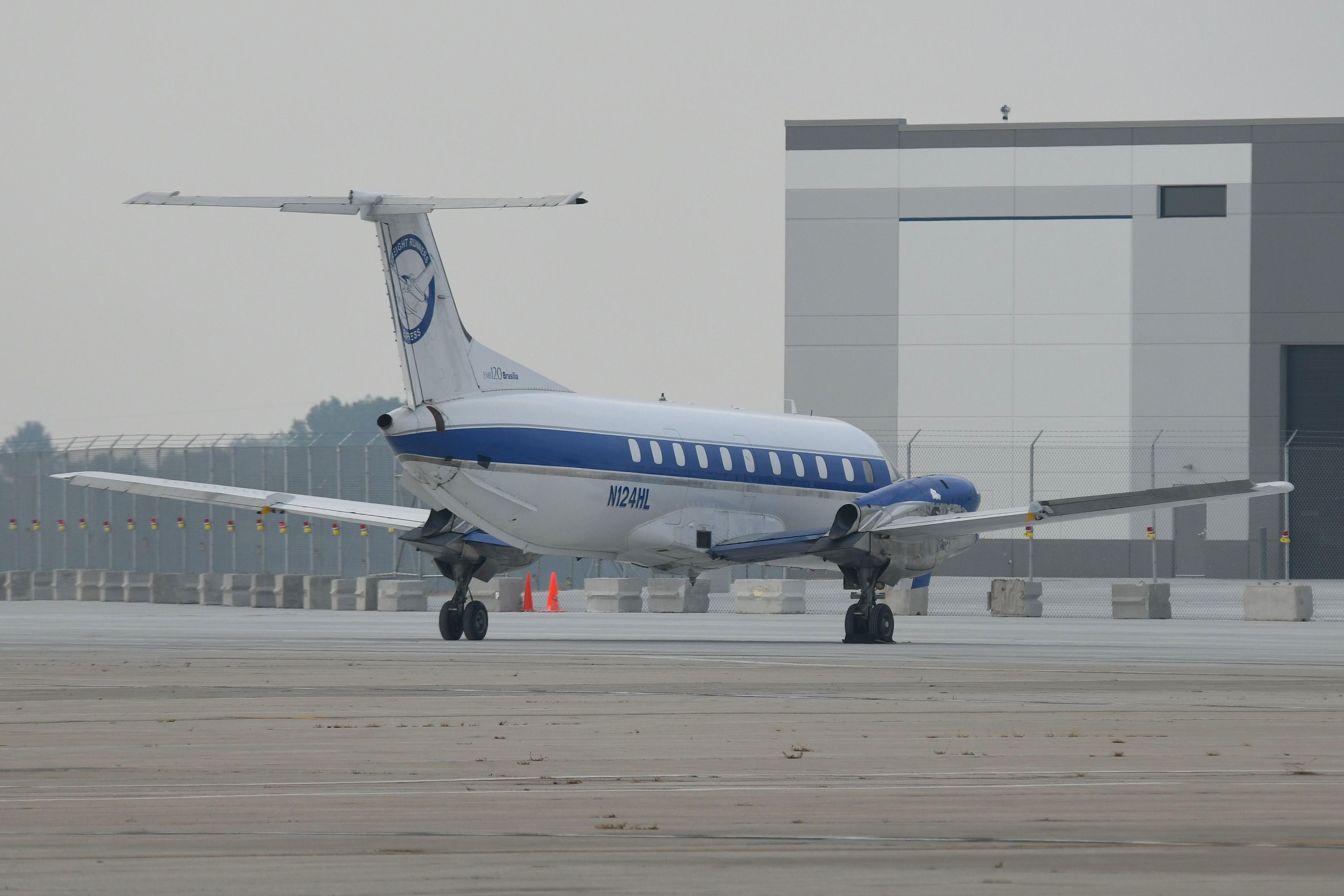 Aircraft N124HL, Freight Runner Express EMB120 parked, at KMKE, photo by FerryPNL