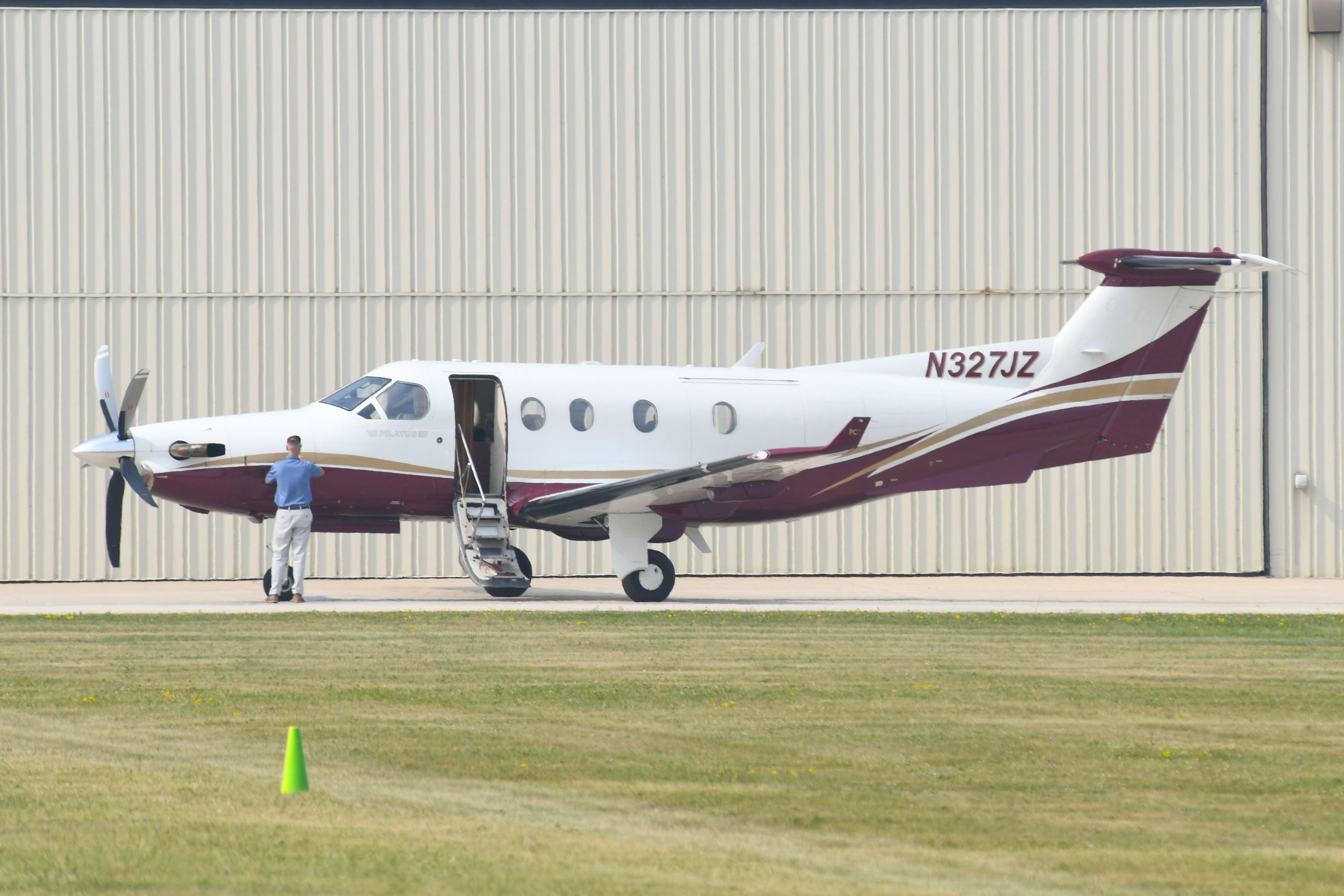 Aircraft N327JZ, DHZ LLC PC12 just arrived, at KFLD, photo by FerryPNL