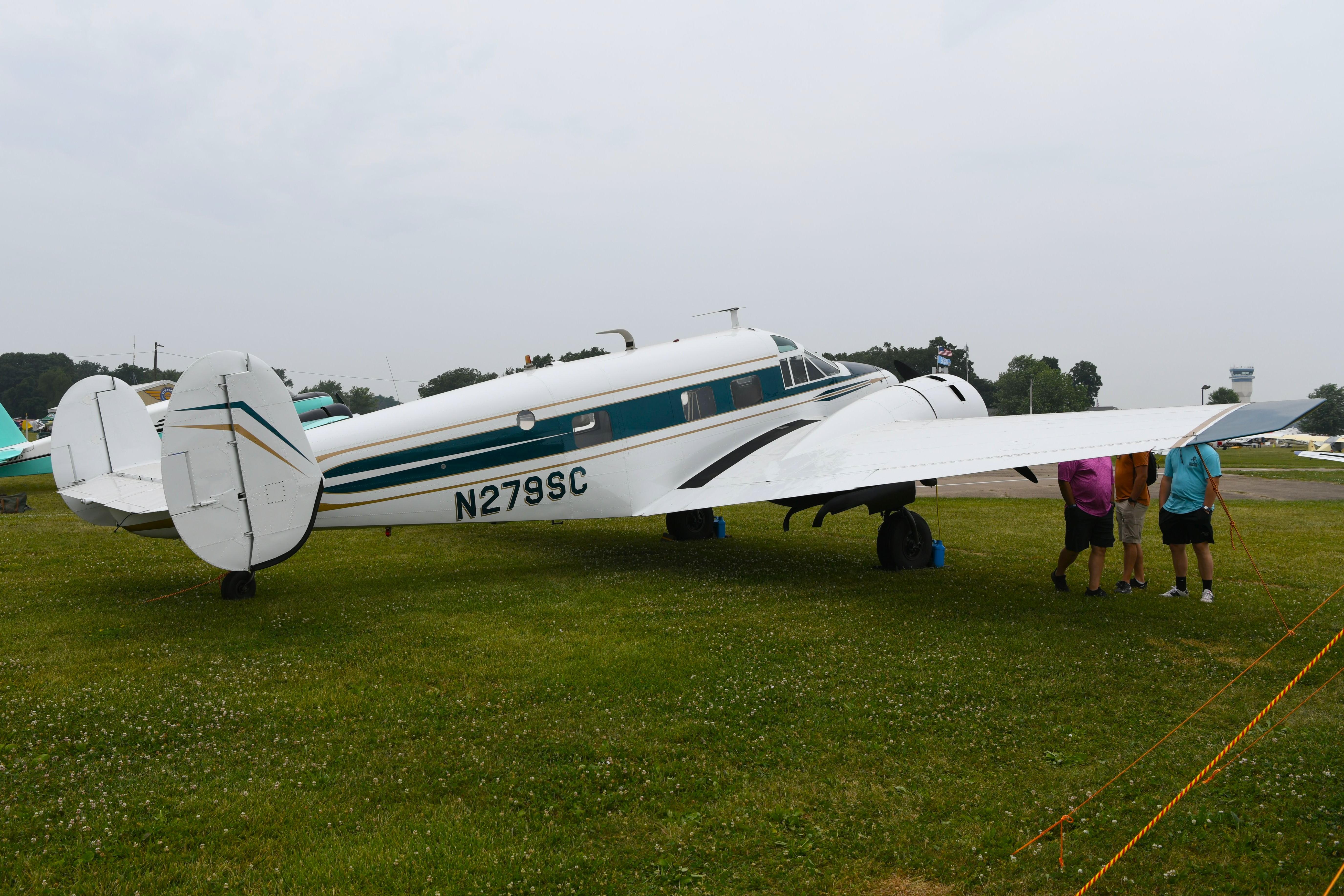 Aircraft N279SC, Be-E18S parked among the classics, at KOSH, photo by FerryPNL